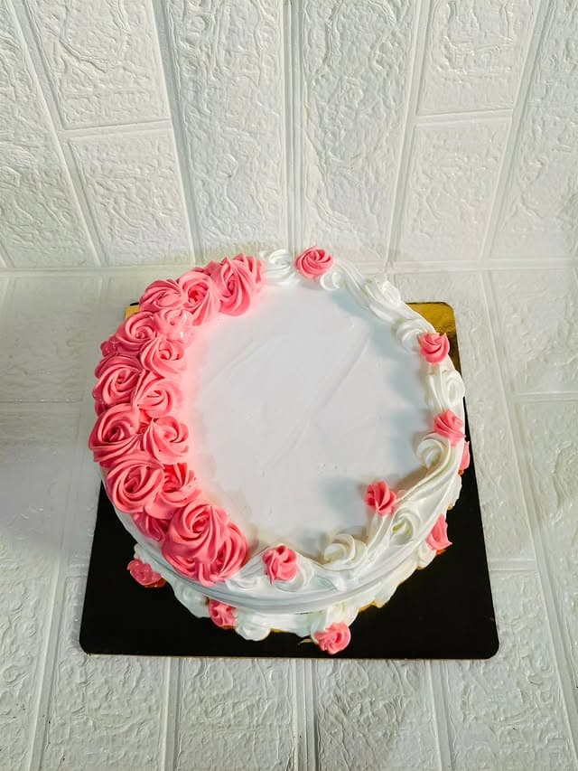 Cream Garland Cake — custom cake in Goa by Sweet Bites