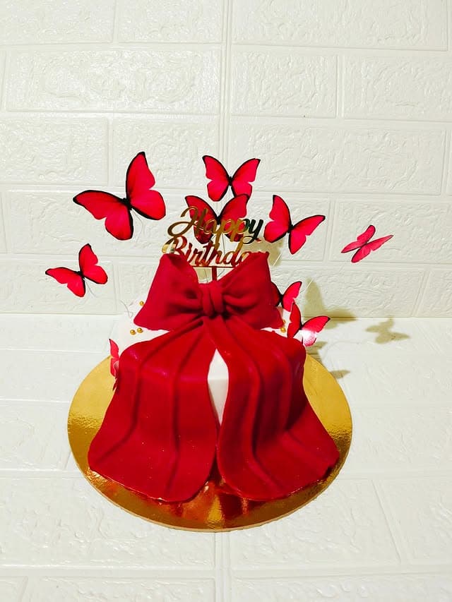 Red Bow Cake — custom cake by Sweet Bites Goa