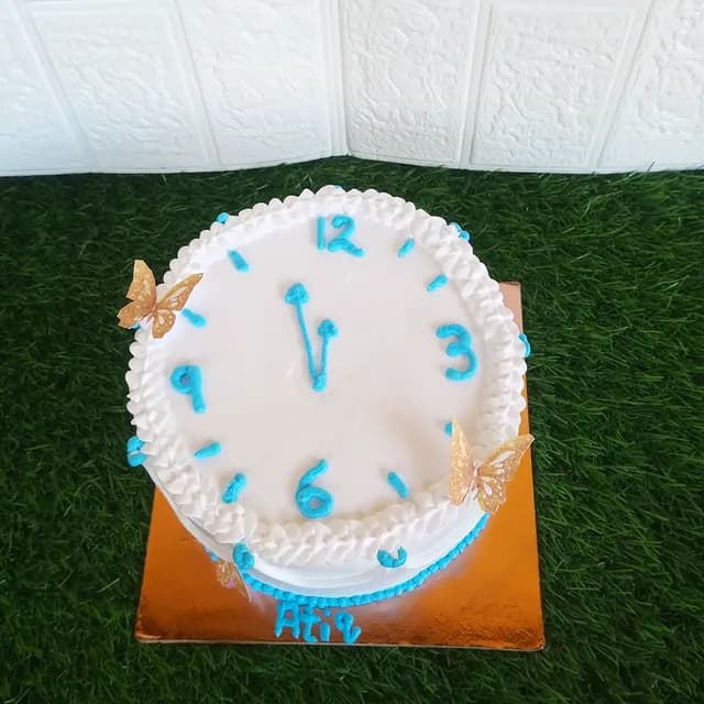 Clock Cream Cake — custom cake by Sweet Bites Goa