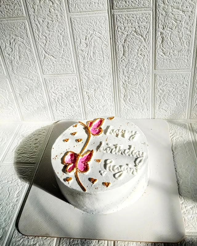 White Butterfly Cream Cake — custom cake in Goa by Sweet Bites